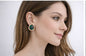 AGM Luxe Emerald Twist Stud Earrings